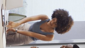 Animation of asterisks forming arrows over multiracial coworkers discussing over laptop in office. Digital composite, multiple exposure, signs, teamwork, communication, growth and technology concept. - Powered by Shutterstock - Get 15% off with code: PIKWIZARD15