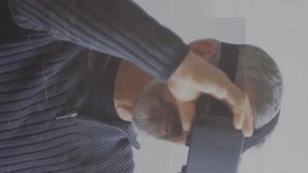 Animation of multiple graphs, trading board over senior caucasian man using vr headset. Digital composite, multiple exposure, report, business, retirement, stock market and technology concept. - Powered by Shutterstock - Get 15% off with code: PIKWIZARD15