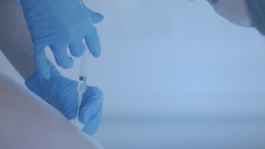 Animation of digital icons data processing over caucasian female doctor vaccinating woman. Global medicine, computing, digital interface and data processing concept digitally generated video. - Powered by Shutterstock - Get 15% off with code: PIKWIZARD15