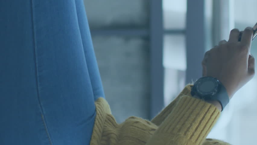 Animation of media icons over african american woman with face mask using smartphone. Global business and digital interface concept digitally generated video. - Powered by Shutterstock - Get 15% off with code: PIKWIZARD15