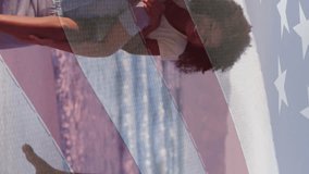 Animation of flag of usa over african american couple with son and daughter on beach. American patriotism, nationality, summer and diversity concept digitally generated video. - Powered by Shutterstock - Get 15% off with code: PIKWIZARD15