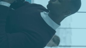 Animation of financial data processing over african american businessman using camera. global business, finance and data processing concept digitally generated video. - Powered by Shutterstock - Get 15% off with code: PIKWIZARD15