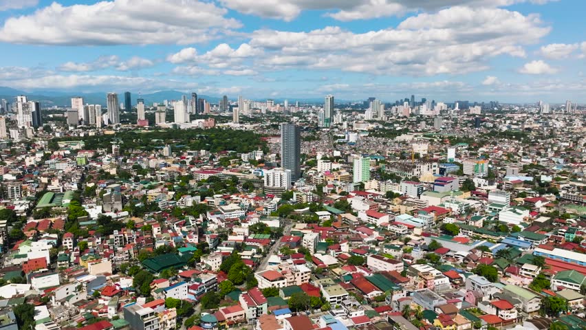 Sprawling urban view featuring vibrant residential neighborhoods and cityscapes. Metro Manila, Philippines.
