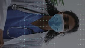 Animation of medical data processing over female doctor in face mask. Global medicine, connections, computing and data processing concept digitally generated video. - Powered by Shutterstock - Get 15% off with code: PIKWIZARD15