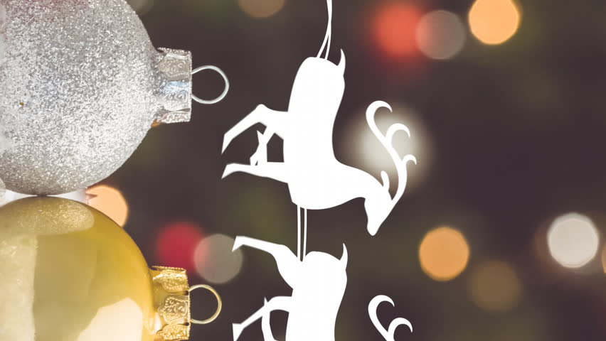 Santa in sleigh with reindeer animation over Christmas ornaments and lights. holiday, festive, celebration, decorations, Santa Claus, winter