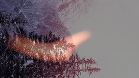 Flame animation over snowy mountain landscape with tall evergreen trees. Nature, winter, contrast, surreal, fantasy, wilderness - Powered by Shutterstock - Get 15% off with code: PIKWIZARD15