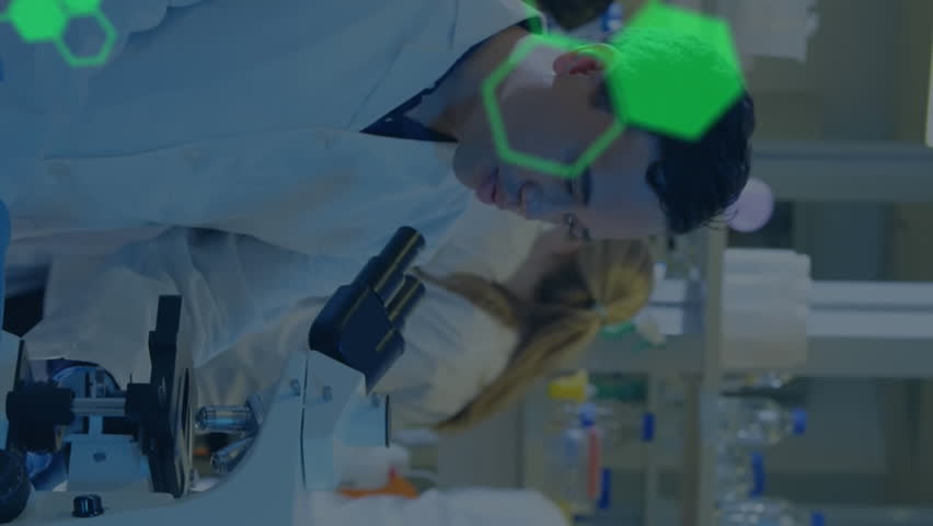 Animation of medical data processing against team of diverse scientists working at laboratory. Medical research and science technology concept - Powered by Shutterstock - Get 15% off with code: PIKWIZARD15