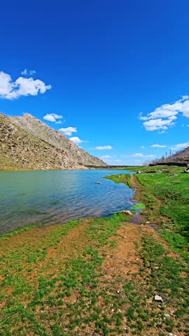 Embrace tranquility at a seasonal wetland, where rocky hills, green fields, and soft clouds reflect serene beauty under a wide open sky.
📍Sarpir , Hawraman Takht 