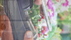 Financial data processing binary coding over earth and wind turbine. the global environment and finance concept are digitally generated video. the hand of customer making payment through smartphone. - Powered by Shutterstock - Get 15% off with code: PIKWIZARD15