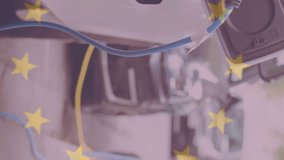 Flag of european union over electric car charging at electric vehicle charging station. ev charging station for electric car, green energy, eco power, sustainability and co2 reduction. - Powered by Shutterstock - Get 15% off with code: PIKWIZARD15