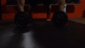 Man gripping dumbbells shifting into plank and performing push-ups while displaying fitness graphs. Strength training, fitness analytics, workout progress, gym equipment, athletic performance, digital - Powered by Shutterstock - Get 15% off with code: PIKWIZARD15