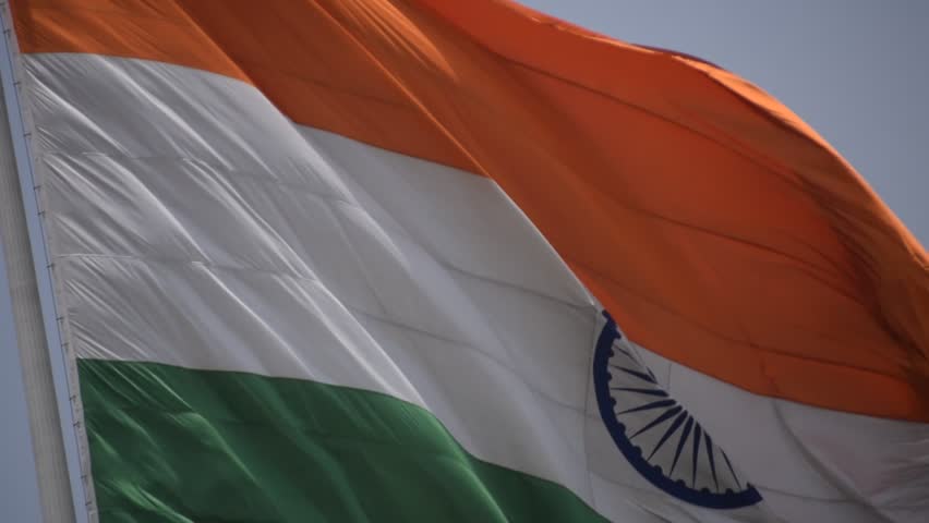 India flag flying high at Connaught Place with pride with plain white background, India flag fluttering, Indian Flag on Independence Day and Republic Day of India, tilt up shot, Har Ghar Tiranga