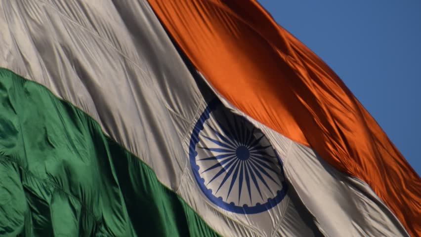 India flag flying high at Connaught Place with pride with plain white background, India flag fluttering, Indian Flag on Independence Day and Republic Day of India, tilt up shot, Har Ghar Tiranga