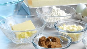 Baking confetti sugar cookies and panning across all the cookie ingredients.. In the kitchen making a dessert. Making confetti cookies with a white background, pink napkin, chocolate chips and eggs. - Powered by Shutterstock - Get 15% off with code: PIKWIZARD15