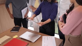 Diverse group adult Asian professionals collaborate strategy discussing financial reports data analysis teamwork modern contemporary office space innovation workshop meeting - Powered by Shutterstock - Get 15% off with code: PIKWIZARD15