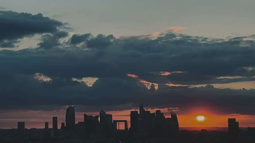 Wide view in depth of Paris from above at sunset