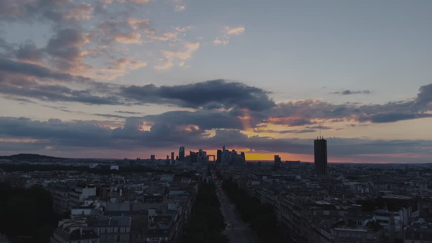 Wide view in depth of Paris from above at sunset