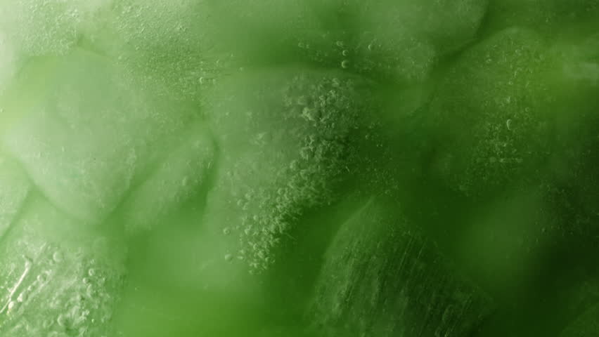 Super Slow Motion Detail Shot of Pouring Cream into Matcha Latte at 1000fps.