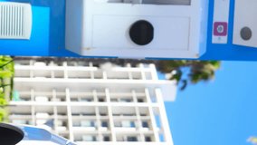 Animation of statistical data processing on mid section of woman charging her electric car. Electronic vehicle and sustainable energy concept - Powered by Shutterstock - Get 15% off with code: PIKWIZARD15