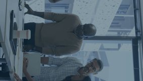 Animation of stock market data processing over diverse colleagues discussing together at office. Global economy and business data technology concept - Powered by Shutterstock - Get 15% off with code: PIKWIZARD15