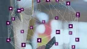 Animation of network of connections with icons over caucasian man scanning qr code. global business and digital interface concept digitally generated video. - Powered by Shutterstock - Get 15% off with code: PIKWIZARD15