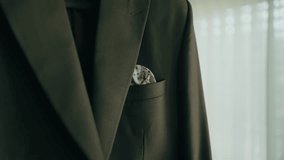 groom suit jacket with folded handkerchief detail indoors - Powered by Shutterstock - Get 15% off with code: PIKWIZARD15