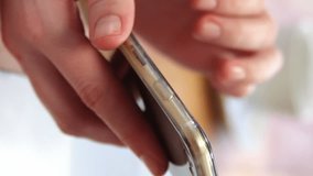 Animation of profile icon and message icon against mid section of a man using a smartphone at office. Social media networking and business technology concept - Powered by Shutterstock - Get 15% off with code: PIKWIZARD15