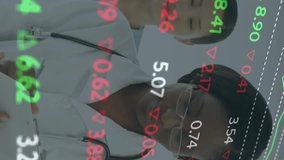 Stock market data animation over medical professionals working in hospital. Healthcare, finance, analysis, technology, business, overlay - Powered by Shutterstock - Get 15% off with code: PIKWIZARD15