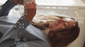 Woman enjoying coffee in kitchen with data processing animation overlay. Technology, connection, lifestyle, leisure, multitasking, morning - Powered by Shutterstock - Get 15% off with code: PIKWIZARD15