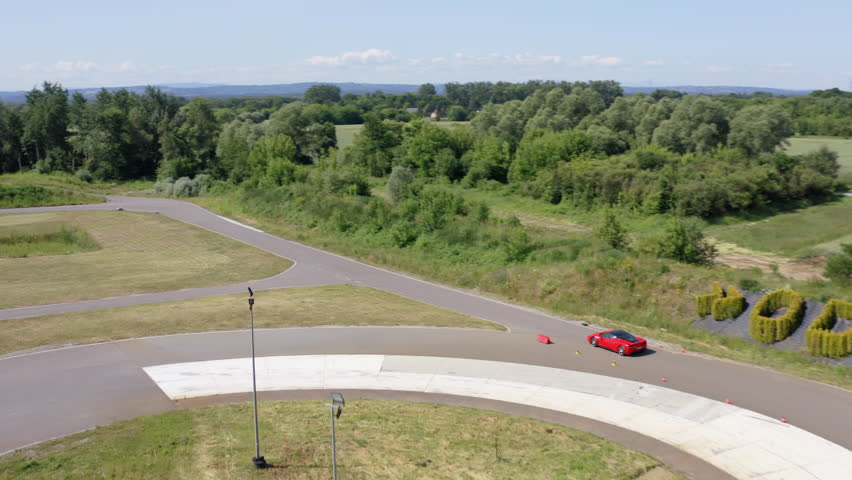 Racer Driving Luxury Sports Car In The Race Track - Practicing Driving Skills. - aerial shot