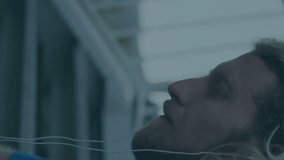 Animation of falling binary codes, graphs, changing numbers, caucasian man adjusting headphones. Digital composite, multiple exposure, report, business, growth, computer language and technology. - Powered by Shutterstock - Get 15% off with code: PIKWIZARD15