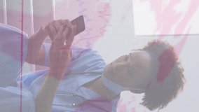 Animation of financial data and virus cells over african american doctor using smartphone. global health and medicine during coronavirus covid 19 pandemic digitally generated video. - Powered by Shutterstock - Get 15% off with code: PIKWIZARD15