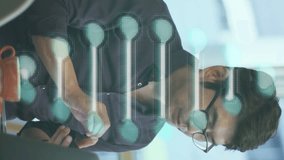 Animation of dna strand spinning over asian businessman using smartphone in office. global research, business, connections and data processing concept digitally generated video. - Powered by Shutterstock - Get 15% off with code: PIKWIZARD15