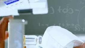 Animation of chemical formulas over hands of caucasian male lab worker with sample. science, chemistry and medicine concept digitally generated video. - Powered by Shutterstock - Get 15% off with code: PIKWIZARD15