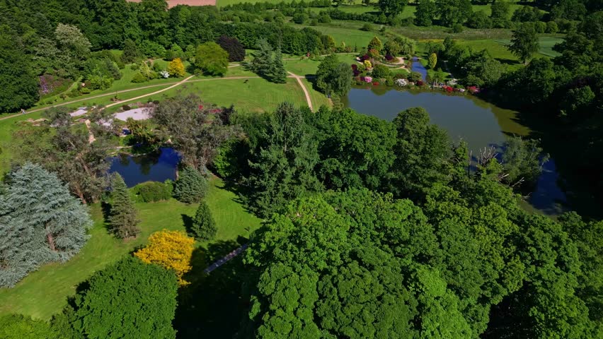 Ponds at Parc de Haute Bretagne, France. Aerial drone forward