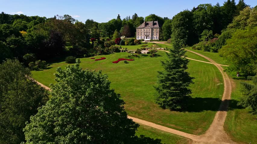 Chateau De La Foltiere, Parc de Haute Bretagne, France. Aerial forward at low altitude, lateral view