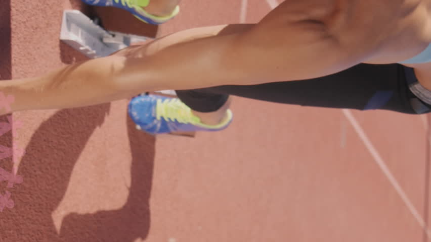 Animation of pink globe and people logos, floating over female runner on running track. breast cancer positive female health awareness campaign concept digitally generated video.