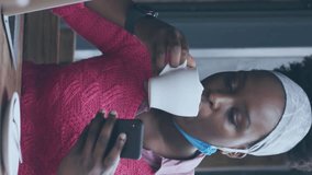 Animation of social media notifications over african american woman using smartphone at cafe. global communication technology and social network concept digitally generated video. - Powered by Shutterstock - Get 15% off with code: PIKWIZARD15