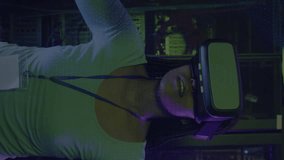 Animation of digital chain over woman using vr headset in server room. Cloud computing, digital interface and security concept digitally generated video. - Powered by Shutterstock - Get 15% off with code: PIKWIZARD15