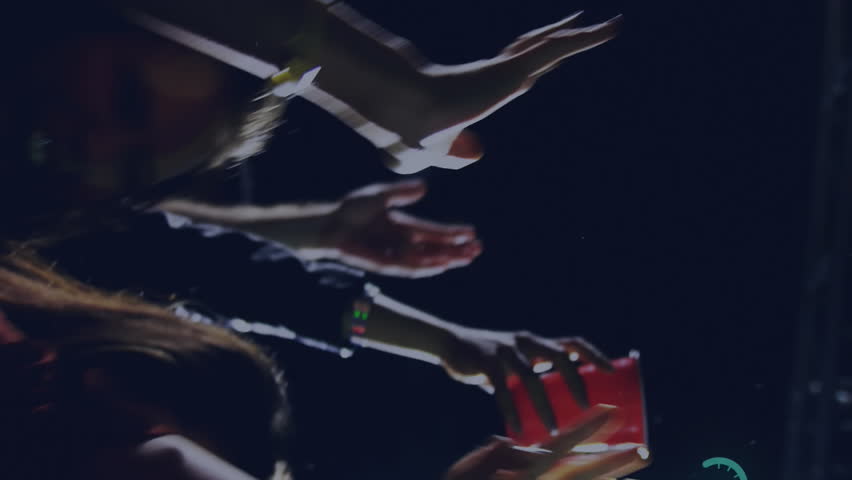 Animation of digital social media interface icons over people dancing and having fun during concert at music venue. Global networking social media entertainment, concept digital composite. - Powered by Shutterstock - Get 15% off with code: PIKWIZARD15