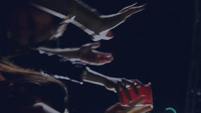 Animation of digital social media interface icons over people dancing and having fun during concert at music venue. Global networking social media entertainment, concept digital composite. - Powered by Shutterstock - Get 15% off with code: PIKWIZARD15