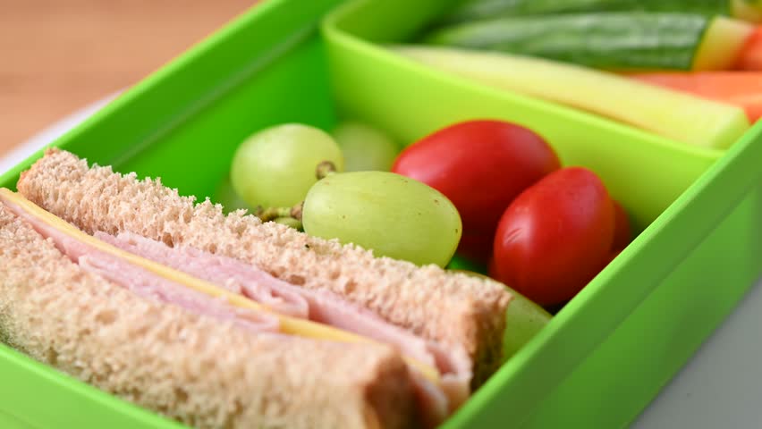 Healthy Lunchbox with Sandwich, Fruits, and Vegetables for school