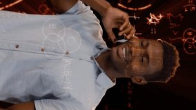 Animation of red mathematical equations floating over African American man talking on the phone in the background. Science, research and global economy concept digitally composite - Powered by Shutterstock - Get 15% off with code: PIKWIZARD15