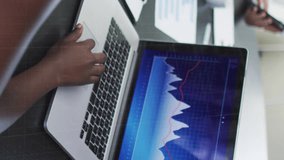 Animation of financial data processing over businesswoman with face mask using laptop in office. global business and digital interface during covid 19 pandemic concept digitally generated video. - Powered by Shutterstock - Get 15% off with code: PIKWIZARD15