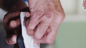 Animation of virus cells over senior caucasian man disinfecting smartphone. medical and healthcare services during coronavirus covid 19 pandemic concept digitally generated video. - Powered by Shutterstock - Get 15% off with code: PIKWIZARD15