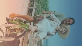 Spots of light against caucasian senior couple riding in a bicycle together at the beach. pedal day awareness concept - Powered by Shutterstock - Get 15% off with code: PIKWIZARD15