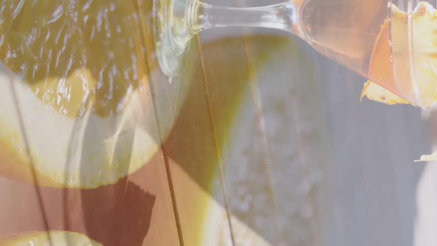Animation of orange slices over caucasian woman at beach. retro communication and social media concept digitally generated video.