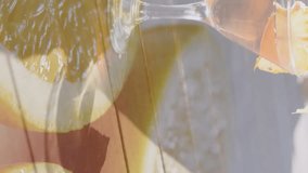 Animation of orange slices over caucasian woman at beach. retro communication and social media concept digitally generated video. - Powered by Shutterstock - Get 15% off with code: PIKWIZARD15