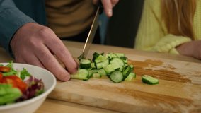 Close up Caucasian family at kitchen cook together cropped view father cutting cucumber cooking fresh vegetable vitamin salad teaching daughter kid child girl cook ingredients product delivery service - Powered by Shutterstock - Get 15% off with code: PIKWIZARD15