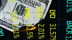Animation of American dollar banknote burning and stock exchange financial data processing on black background. Global finance and business concept digitally generated image. - Powered by Shutterstock - Get 15% off with code: PIKWIZARD15